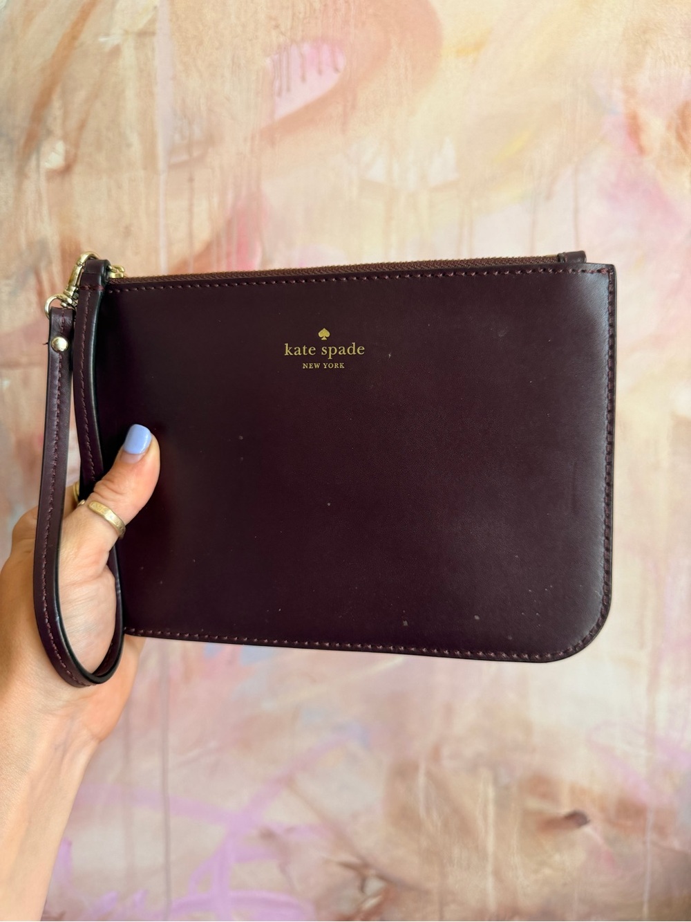 kate spade Plum Leather Wristlet with Gold Logo